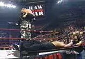 Bubba Ray Dudley Powerbombs the Hardy Boyz Through Triple Stacke