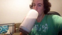 KID DRINKS CHOCLATE MILK FROM THE BOTTLE