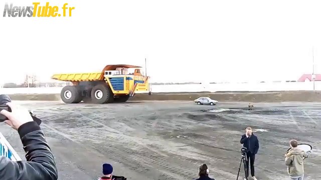 Car gets crushed by 450 ton truck