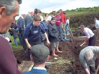 Turf Cutting in Glinsk, June '09 - Mickie Grady cutting, Andrew Grady catching