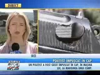 Politist gasit impuscat in cap