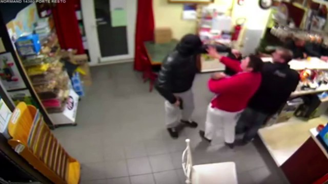 Shocking footage of barehanded woman taking on armed robber