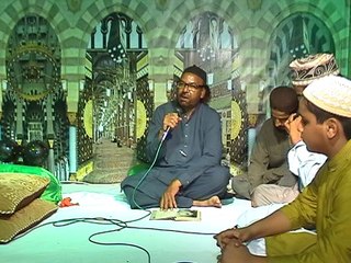 Mohtaram Hanif Abid Mehfil e Milad main Janab Rais Froughe ki Nazam parh rahay hain