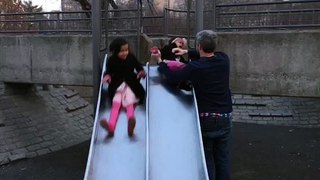 Girls in on slide in Central Park