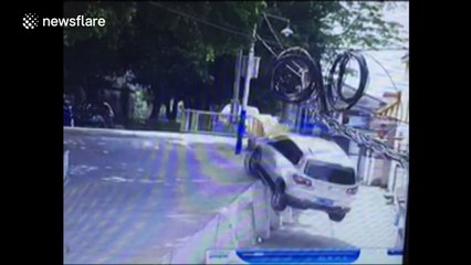 Driver accidentally drives off two metre high ramp while reversing