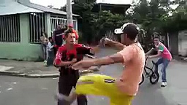 drunk people fighting in street..