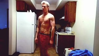 Guy taking his shirt off in slow motion while wear