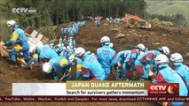 Japan earthquake: search for survivors gathers momentum