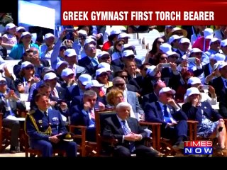 Flame lit for troubled 2016 Olympics in Rio