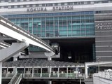 Kitakyushu Monorail train departs the building of Kokura station