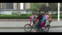Scooter carrying 06 passengers pulled over by Police