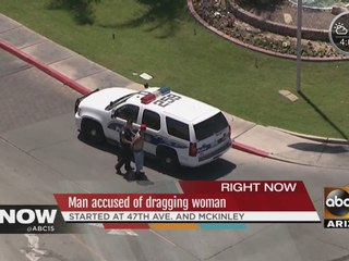 Man accused of dragging woman in Phoenix parking lot