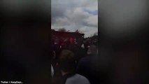 Fans cheer as Man United fan falls through roof