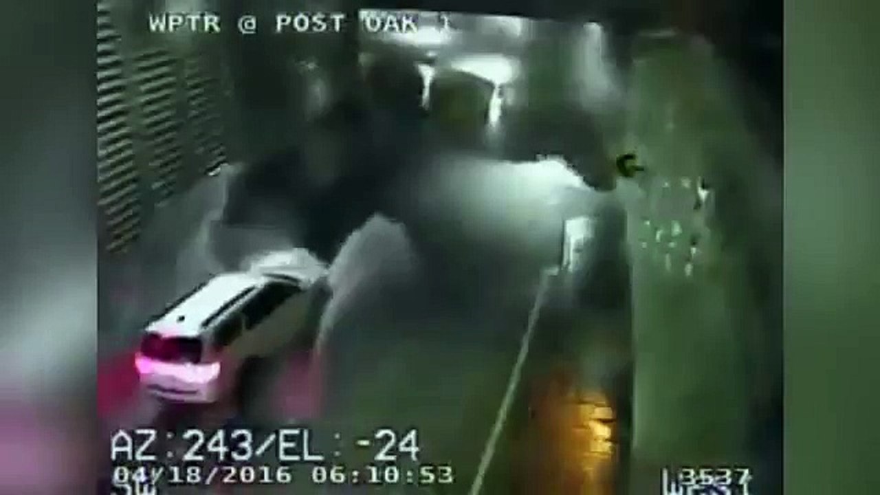 Woman caught on camera driving to her death is unable to escape as car submerges in flood water