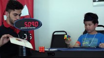 Kid solving a Rubik's cube blindfolded