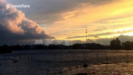 Time-lapse footage of a glowing, orange sunset in China