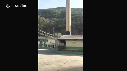 Two large smoke chimneys demolished with explosives in Jamaica