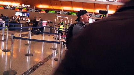 Guns N' Roses' Axl Rose rides scooter through LAX airport after breaking foot