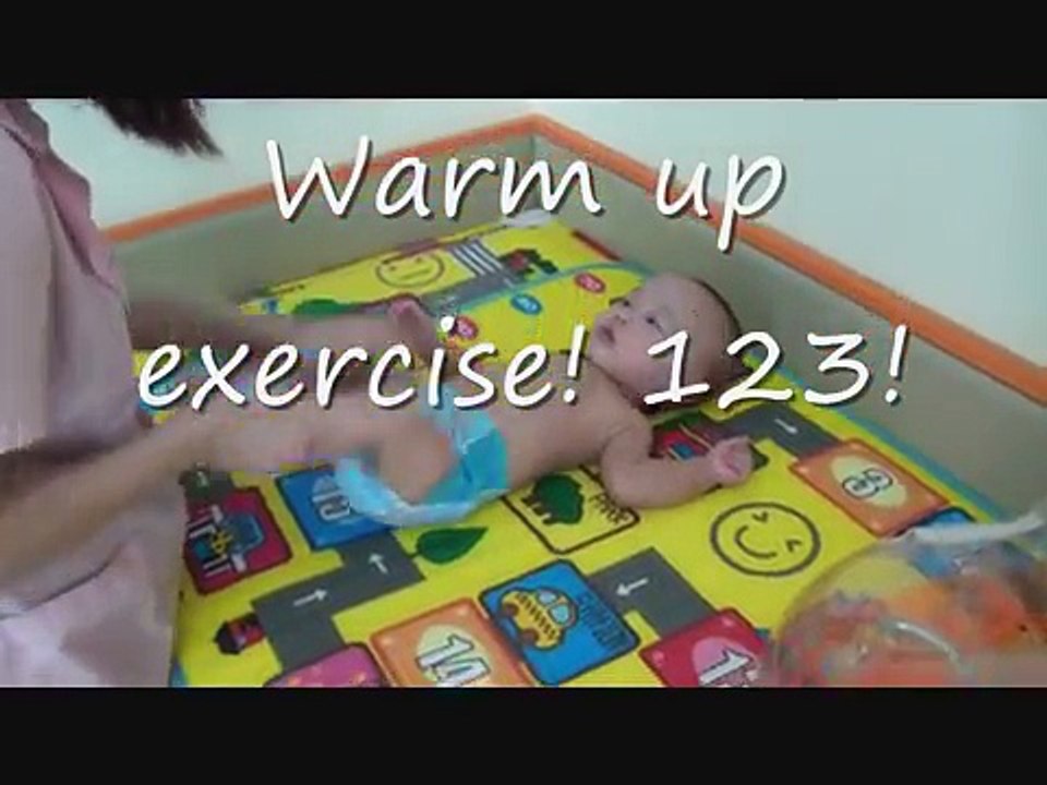 Triplets' first swimming lesson