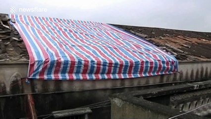 Powerful tornado damages buildings and injures six in southern China