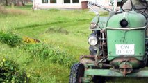 Deutz D15 mowing grass.