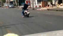 Man drives moped down street while unconscious