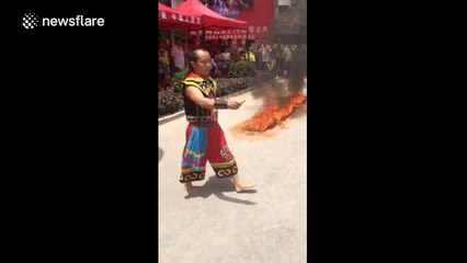 Man walks through fire, barefoot