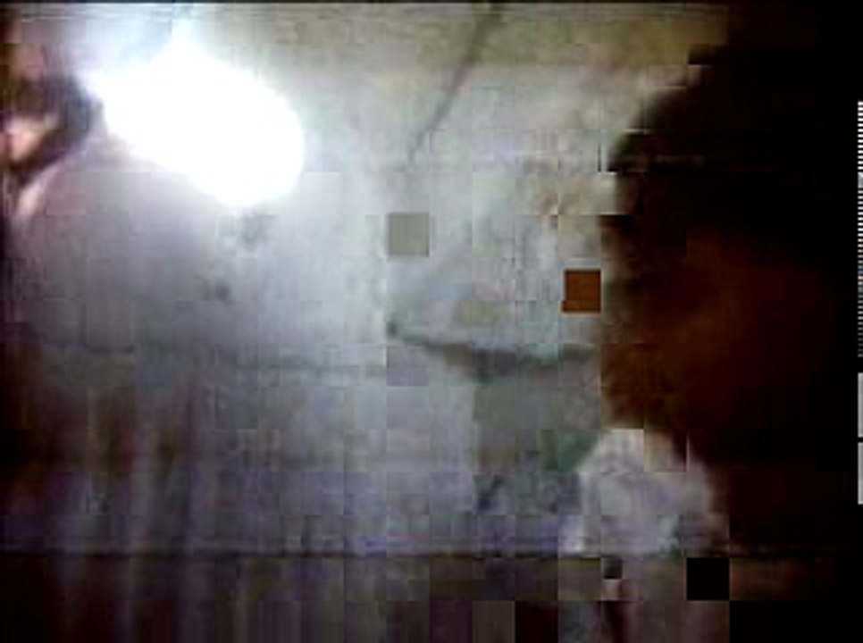 Aboard the Apollo 11 Command Module, Michael Collins shows where he sleeps