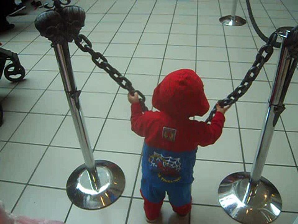 little baby spiderman at the chain
