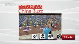 Thousands of young students practice yoga at sports meeting