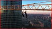 Daredevils Fearlessly Hanging From a Crane in Moscow
