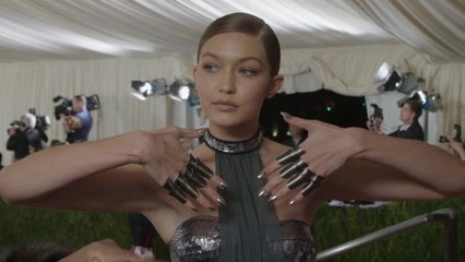 Gigi Hadid on Her Futuristic Bathing Suit and Chrome Knuckles at Met Gala 2016