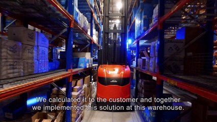 Picking with small aisle trucks in high bay warehouse