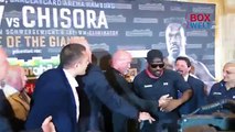 Dereck Chisora attacks Kubrat Pulev during face off at pre fight press conference