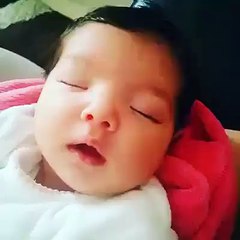 Cute Baby Smiles  In A Deep Sleep