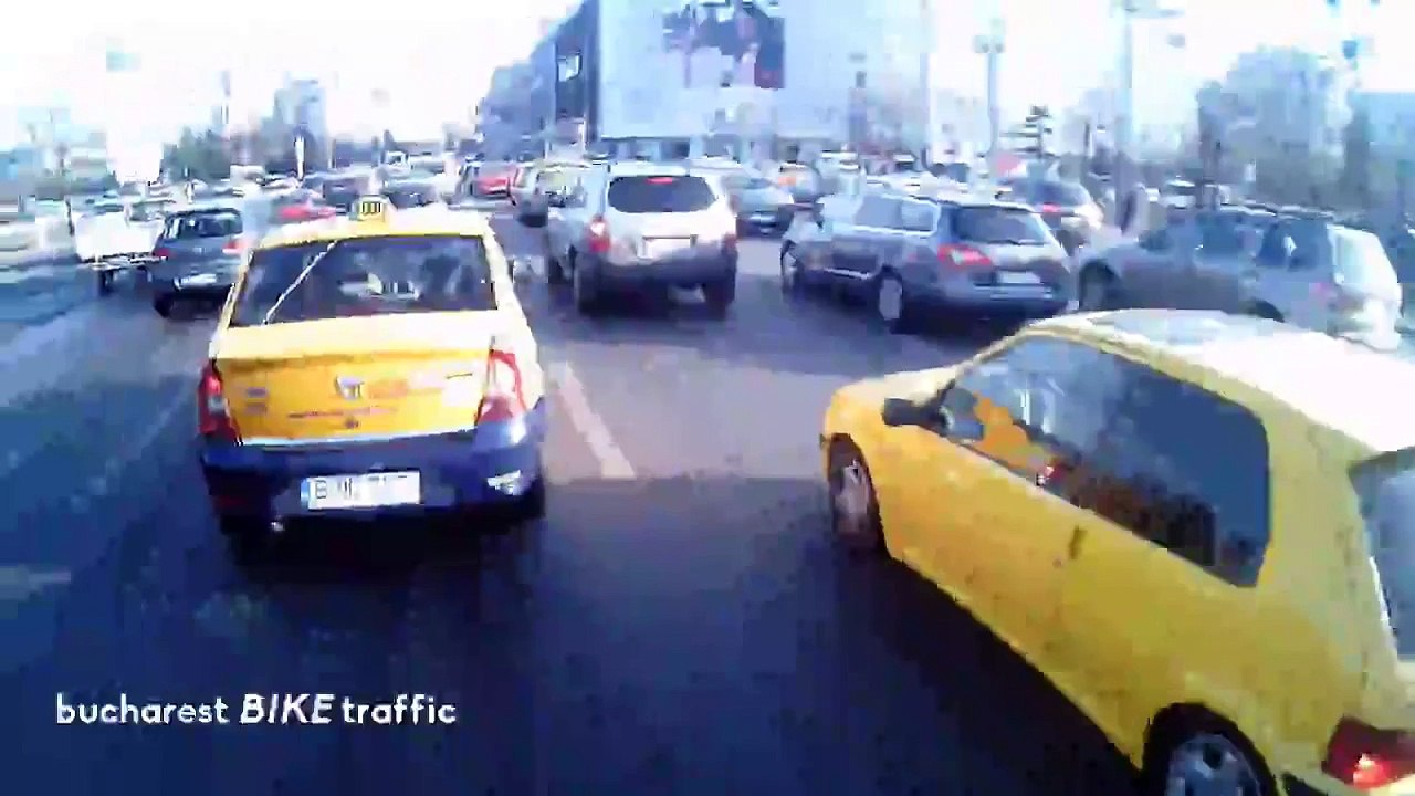 BMW Hits Curb Trying to Pass Cyclist