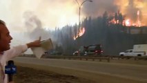 Caught on camera- Fort McMurray fire erupts behind Global News reporter