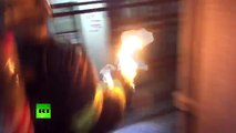 No Fear! Fireman pulls burning gas tank from building in China with no harm