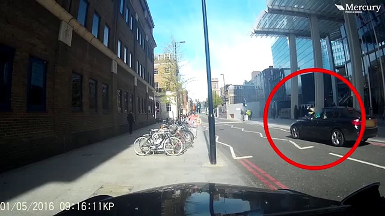 'Distracted' cyclist crashes into BMW on wrong side of road after peeking into l