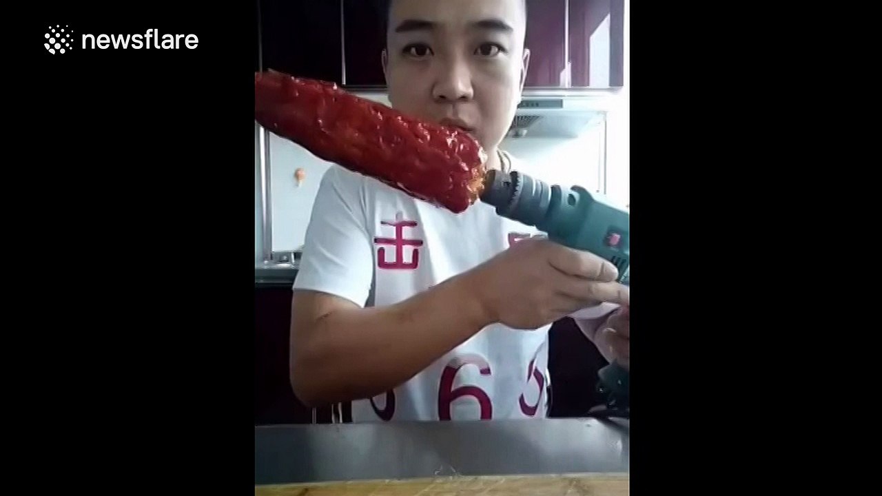 Man eats tomato ketchup-covered corn on the cob... with power drill
