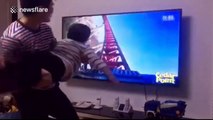 Father creates human rollercoaster for his son while watching a POV rollercoaster ride on TV
