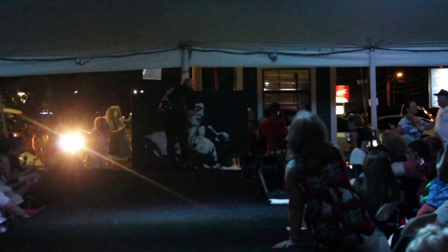 Chris Drummond painting an Elvis portrait at Elvis Week 2014