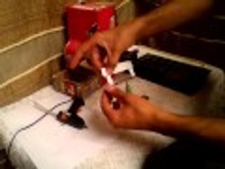 آلة بيع العلكة (نظام فحص القطع النقدية)