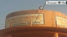 man Climbed water tank