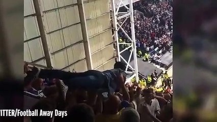 Watch a Leeds fan CROWD SURF all the way from the very top of Preston's away end