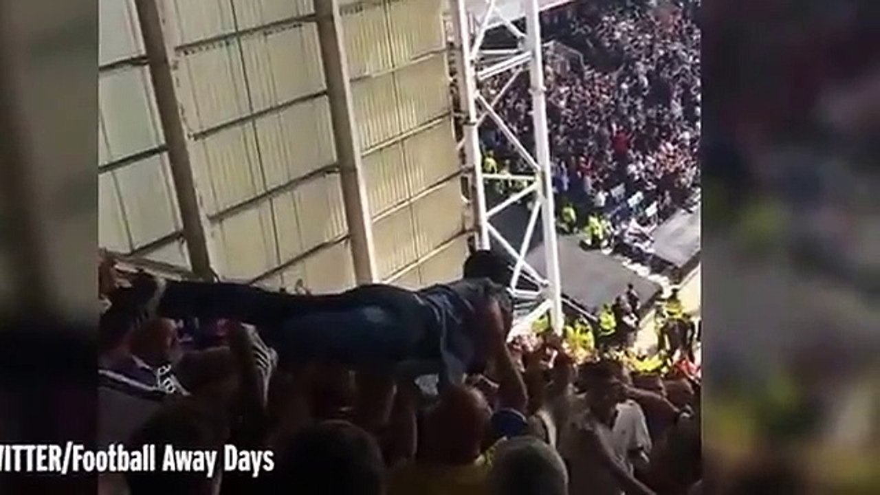 Watch a Leeds fan CROWD SURF all the way from the very top of Preston's away end