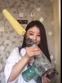 Asian Girl eating Corn with a drill fail