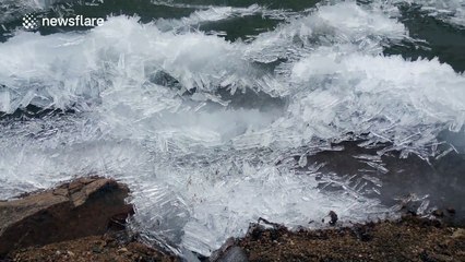 Beautiful ice needles cumple and creak on Russian lake