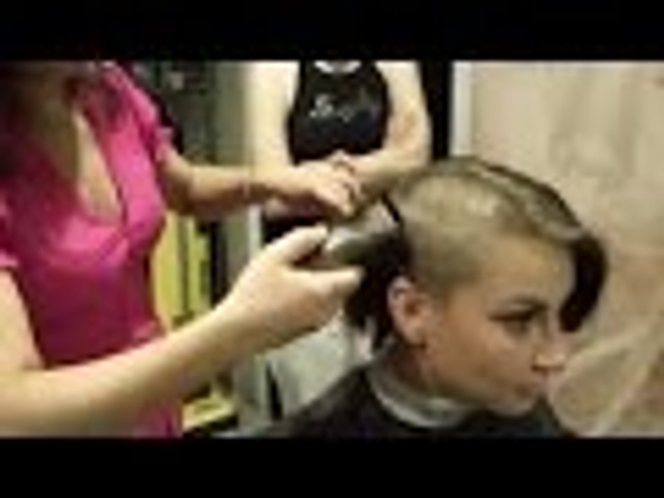 Girl shaves her head for charity