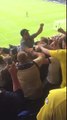 Leeds United fan crowd surfs on a surf board v Preston North End Football Club